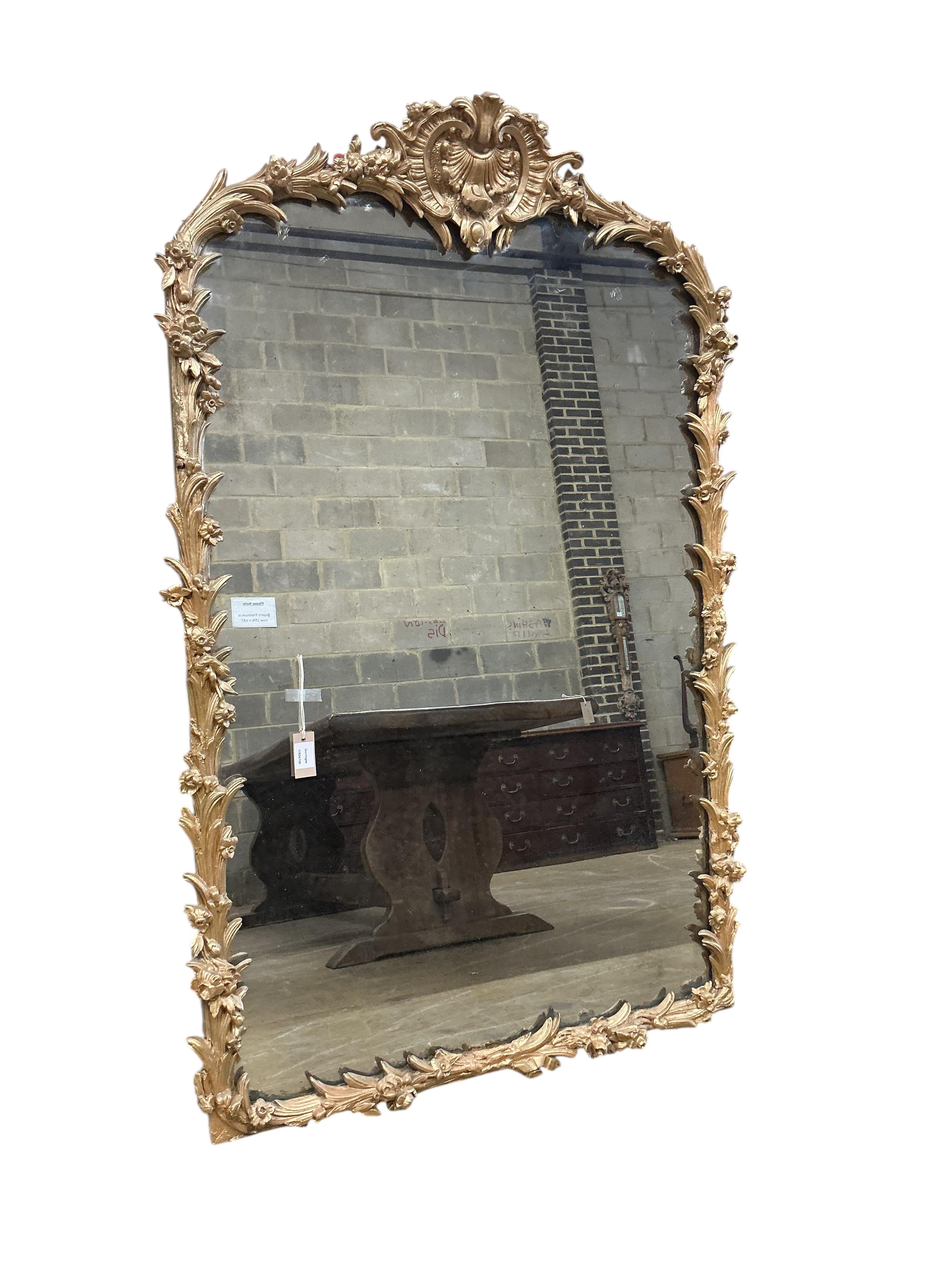 A Victorian carved giltwood and composition overmantel mirror, with later painted decoration, width 104cm, height 161cm